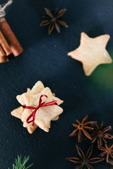 Star shaped cookies with cinnamon and anise on the table