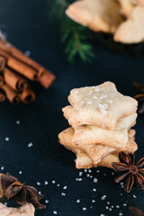 Star shaped cookies with cinnamon and anise on the table