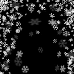 Snowfall background with snowflakes blurred in the dark