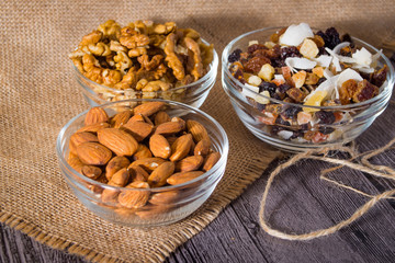 Nuts and dried fruits on wooden background