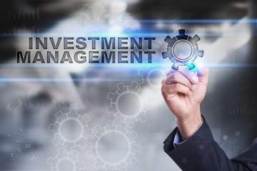 Businessman is drawing on virtual screen. investment management concept