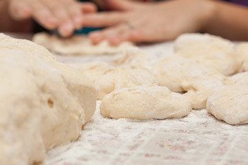 homemade cakes of the dough in the women's hands