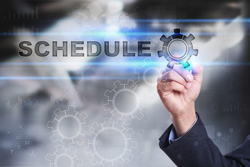 Businessman is drawing on virtual screen. schedule concept
