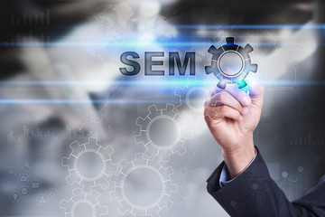 Businessman is drawing on virtual screen. sem concept