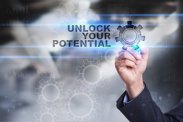 Businessman is drawing on virtual screen. unlock your potential concept