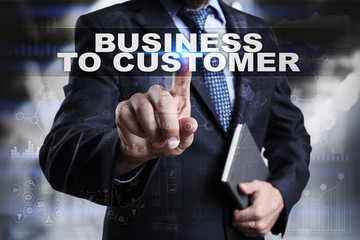 Businessman is pressing button on touch screen interface and selecting business to customer.