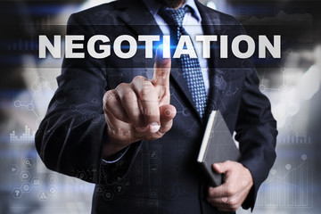 Businessman is pressing button on touch screen interface and selecting negotiation.