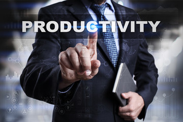 Businessman is pressing button on touch screen interface and selecting productivity.