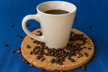 Coffee. Coffee cup with coffee beans. Toned image.