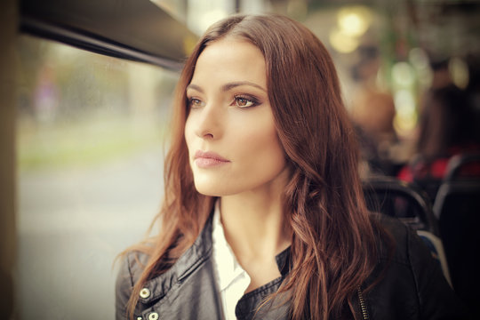 Beautiful woman traveling by bus