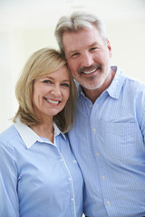 Portrait Of Loving Mature Couple At Home