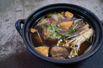 Buk Kut Teh, a Chinese pork soup dish, eat with rice and some vegetable, normally found in Malaysia and Singapore