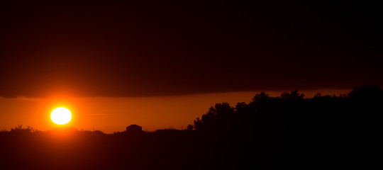 Panorama of Amazing Beautiful Sunset Sunrise Over Dark Landscape Silhouette