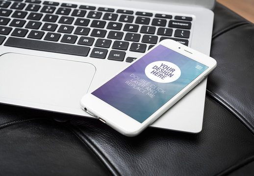 Smartphone on Laptop Mockup