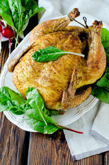 Baked chicken with spices and chard leaves