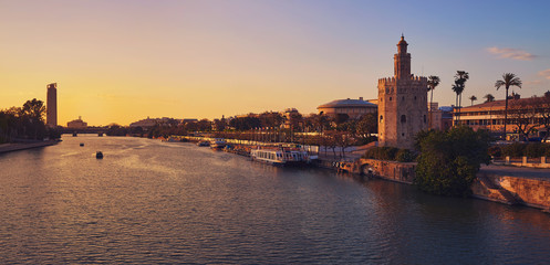 Fototapeta premium Seville sunset skyline torre del Oro in Sevilla
