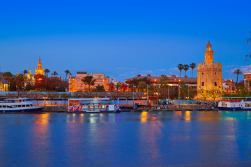 Fototapeta premium Seville sunset skyline torre del Oro and Giralda