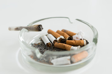 close - up cigarette and ashtray
