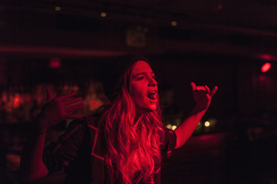 Young woman performing at a nightclub