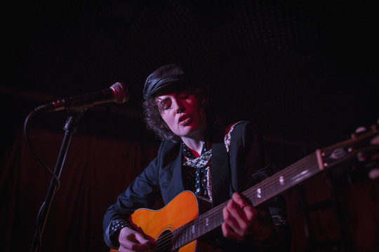 Guitarist performing at a nightclub