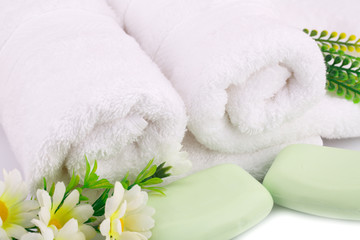 Towel, soaps and flowers