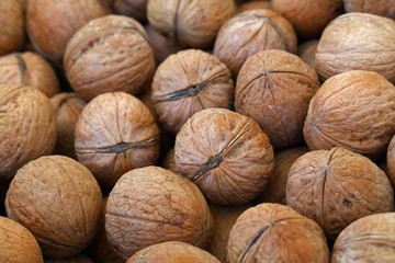 Whole walnuts in nutshells close up