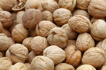 Whole walnuts in nutshells close up
