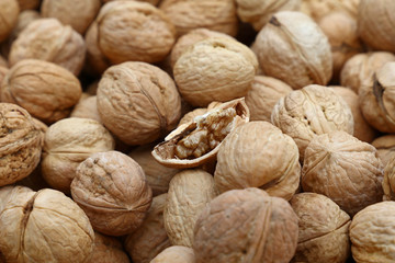 Whole walnuts in nutshells close up
