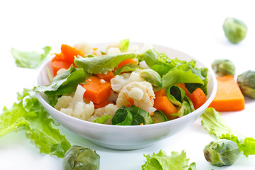 salad of lettuce, cauliflower and Brussels sprouts with a pumpkin
