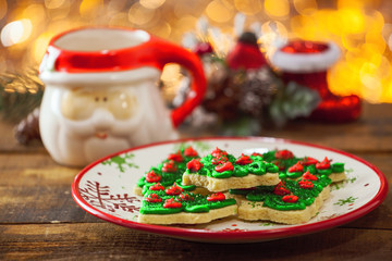 Christmas Tree Cookies On Holiday Plate By Warm Glowing Light Fire