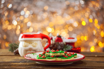 Christmas Tree Cookies On Holiday Plate By Warm Glowing Light Fire