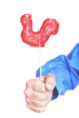 Candy Cockerel symbol of 2017 on white background