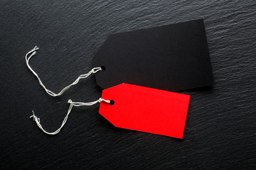 Blank price tags on dark background