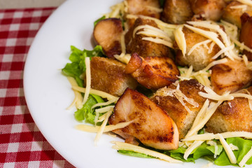 Caesar salad with chicken and croutons