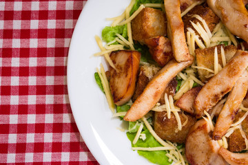 Caesar salad with chicken and croutons