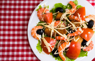 Caesar salad with shrimps and croutons