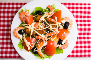 Caesar salad with shrimps and croutons