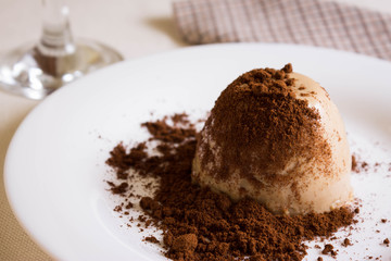Panna cotta topped with grated chocolate