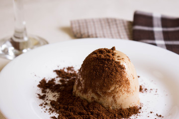 Panna cotta topped with grated chocolate