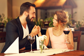 Romantic couple dating in restaurant