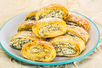 Sweet yeast rolls with cheese and poppy seeds