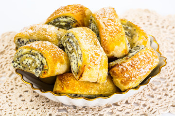 Sweet yeast rolls with cheese and poppy seeds