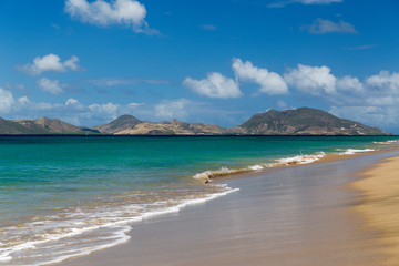 Fototapeta na wymiar St Kitts from a beach on St Nevis in the Caribbean