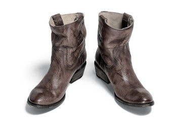 Pair of traditional cowboy boots retro tone