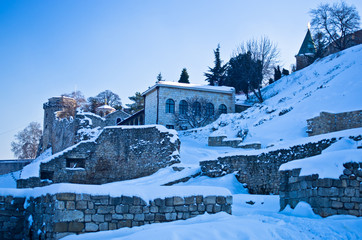 Fototapeta na wymiar Kalemegdan fortress covered with snow. Fortress is positioned at the confluence of rivers Danube and Sava, at the city of Belgrade, Serbia