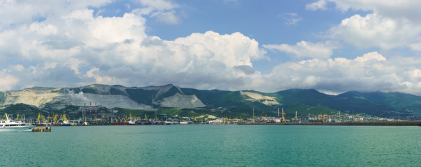 Panorama of Novorossiysk commercial sea port on the background of sky and mountains
