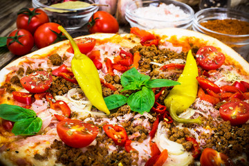 Rustic Italian Pizza on a Thin Pastry with Minced Pork, Ham, Tom