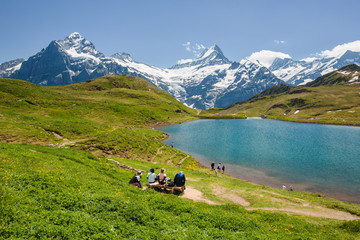 Fototapeta na wymiar People looking at Bachsee, Alps, Switzerland