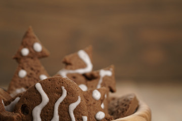 chrismas chocolate cookies in wooden bowl on oak table