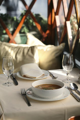 Shrimp soup fine dining – set table in a restaurant 